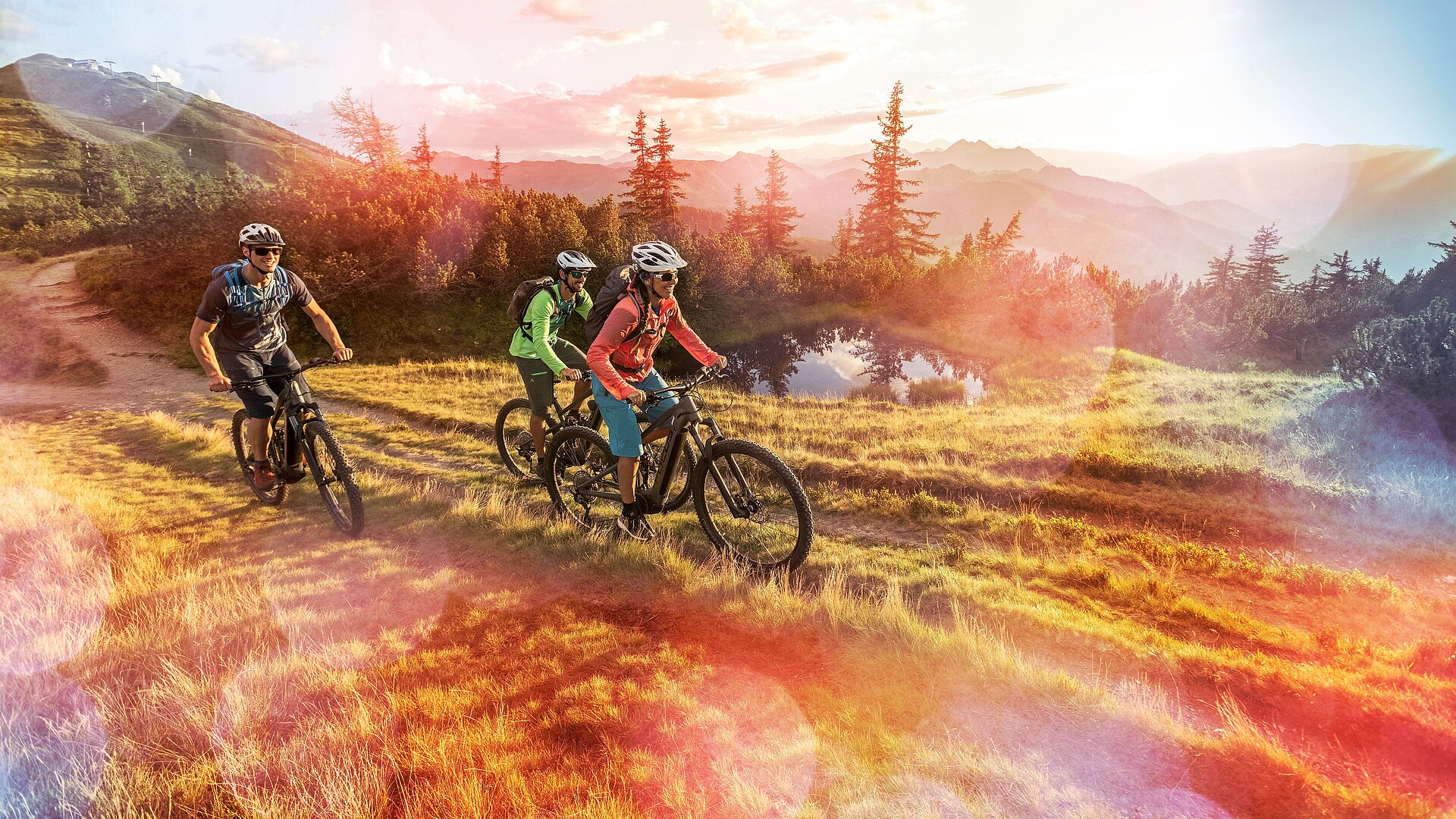 E-mountain bikers enjoy the Flachau mountains.